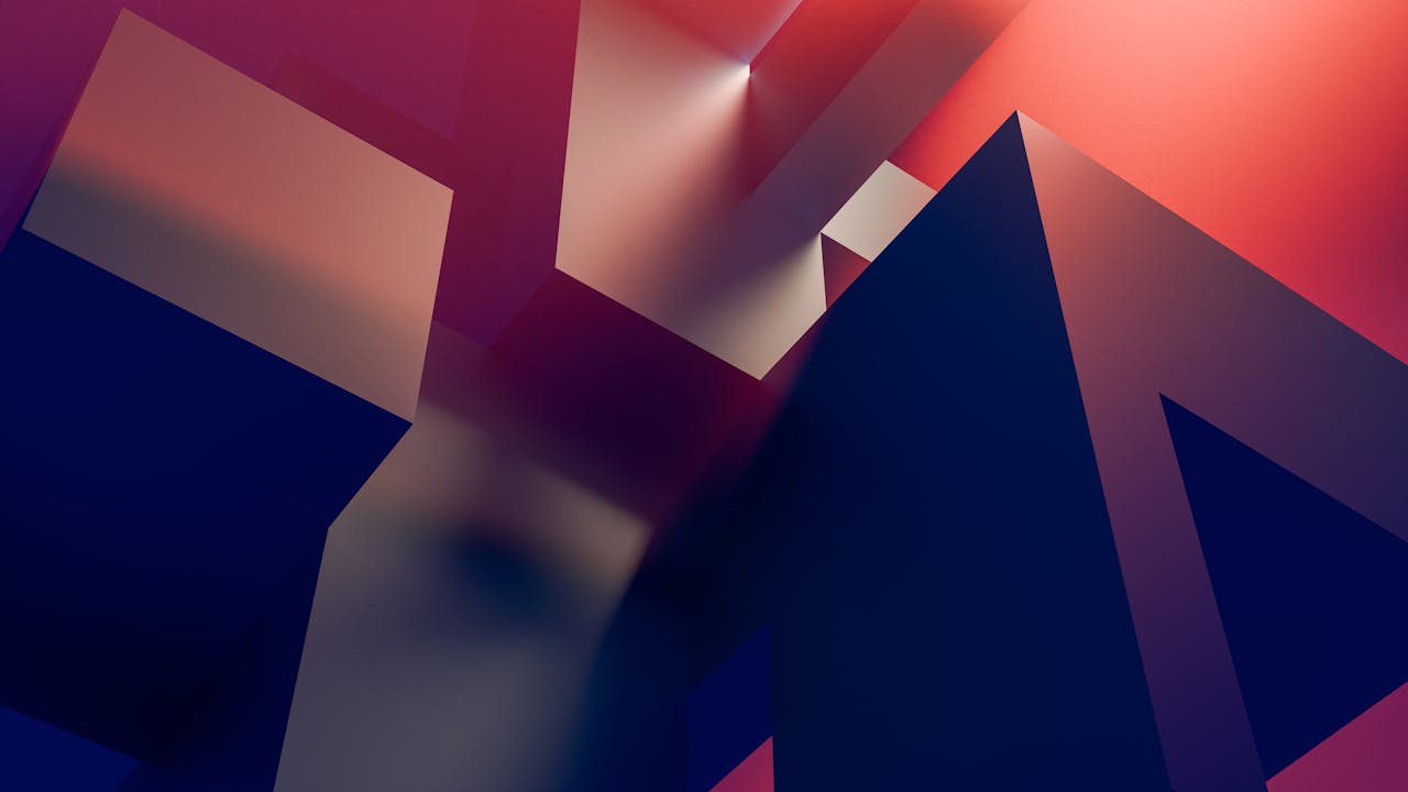 Dynamic abstract geometric shapes with a gradient of dark blue and warm pink tones.